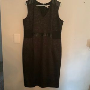 Elegant dress with black faux leather trim